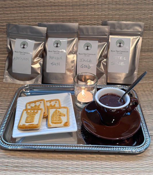 Our Four Premium Chocolates, Brown Ceramic Demitasse Cup and Saucer, and silver metal tray